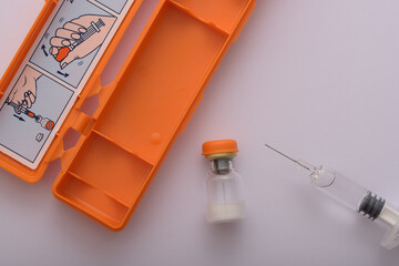 Syringe with glucagon on a white background in high resolution. Diabetes. Diabetic coma. Hypoglycemia.