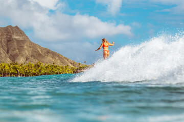 Surfer Riding Wave with Diamond Head