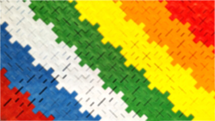 Vibrant rainbow background in puzzle toy, blurred multi-colored concept
