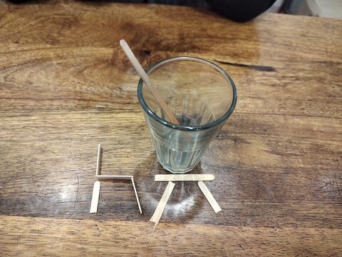 Tea glass sitting on the table , expecting somone for company 