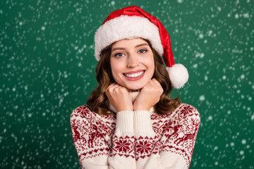 Photo of adorable charming girl beaming smile hands touch jumper collar enjoy christmastime...