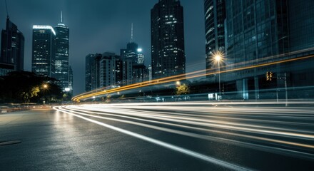 Fototapeta premium Night cityscape with light trails in urban setting