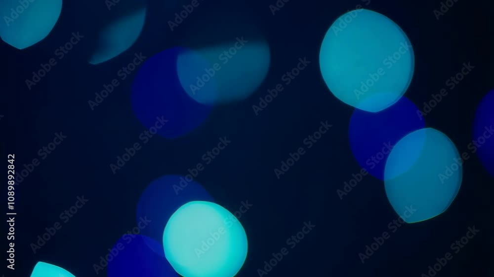 Poster softly glowing orbs in various colors and sizes float serenely against a deep blue backdrop, evoking