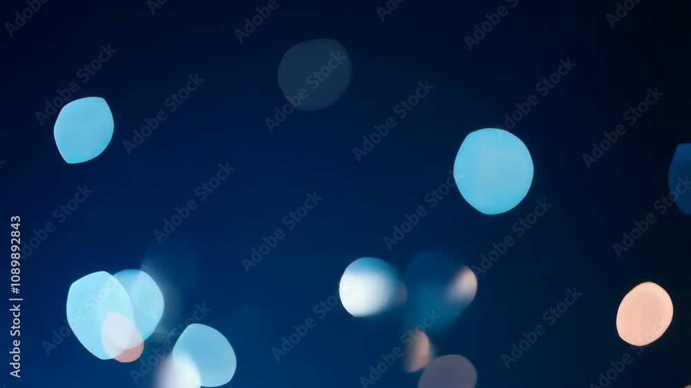 Poster abstract bokeh lights in varying colors and sizes drift seamlessly against a dark blue backdrop, evo