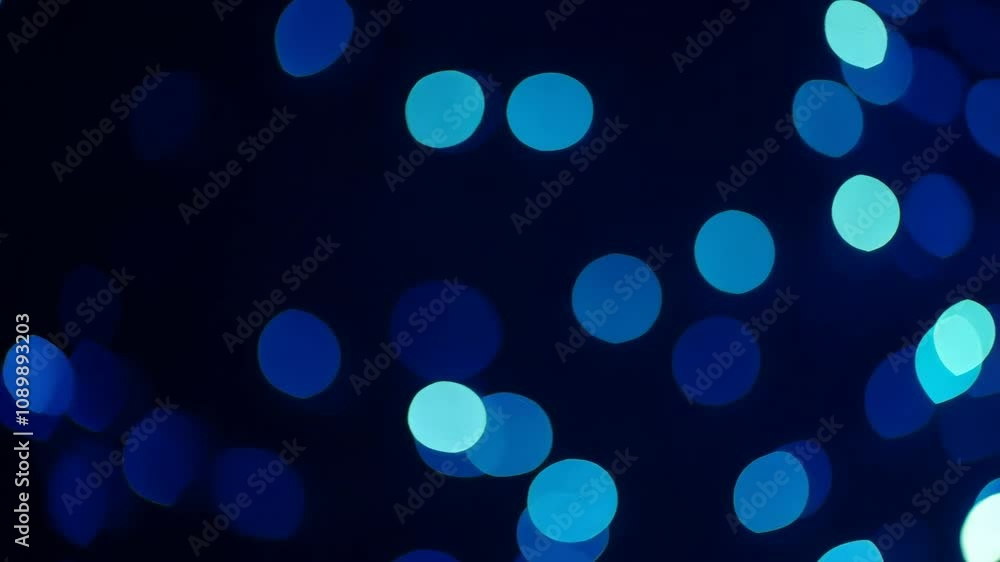 Poster abstract glowing orbs in a variety of colors move gently against a dark blue backdrop, creating a so