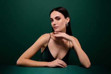 Photo of stunning lady dressed sexy outfit hand arm chin isolated green color background