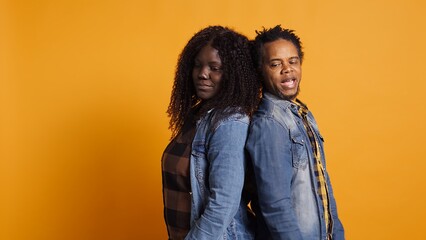 Furious offended couple having an argument and screaming at each other, dealing with marriage...
