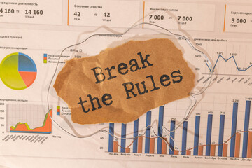 Bold text 'Break The Rules' on a white paper wrapped in plastic.