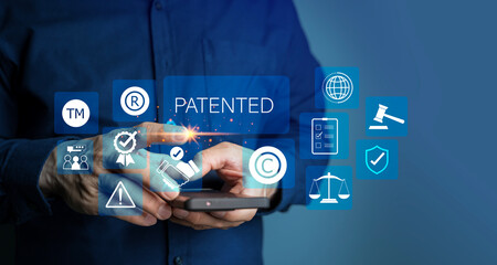 Patented patent copyright law business technology concept. businessman touch virtual screen