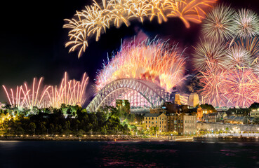 Sydney Harbour Bridge New Years Eve fireworks, colourful NYE fire works lighting the night skies with vivid multi colours NSW Australia. 