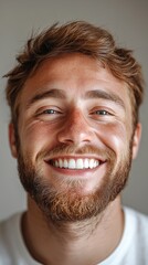 Fototapeta premium Portrait of a cheerful man with a wide smile and light beard