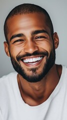 Obraz premium Happy young man with a beard and shaved head