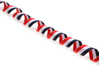 Fototapeta premium Ribbon in colors of Yemeni flag isolated on white