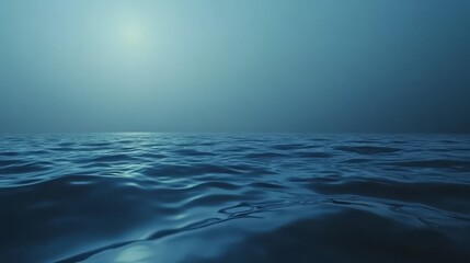 Obraz premium Serene ocean at dusk, calm waves, dark blue water.