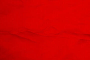 Horizontal photo. Red textile background with creases, folds background for banner, social media template. Scarlet luxury and elegant matte textile fabric texture. Mock up. Copy space for text