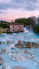 Revitalizing moments at Saturnia thermal baths in Tuscany during sunset