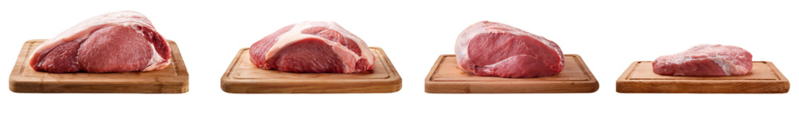 Fototapeta premium Fresh cuts of meat displayed on wooden boards, showcasing quality and variety for culinary preparation.
