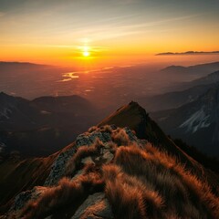 Fototapeta premium Sunset view from a mountain peak, overlooking a scenic valley