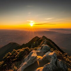 Obraz premium Sunset view from a mountain peak, overlooking a scenic valley