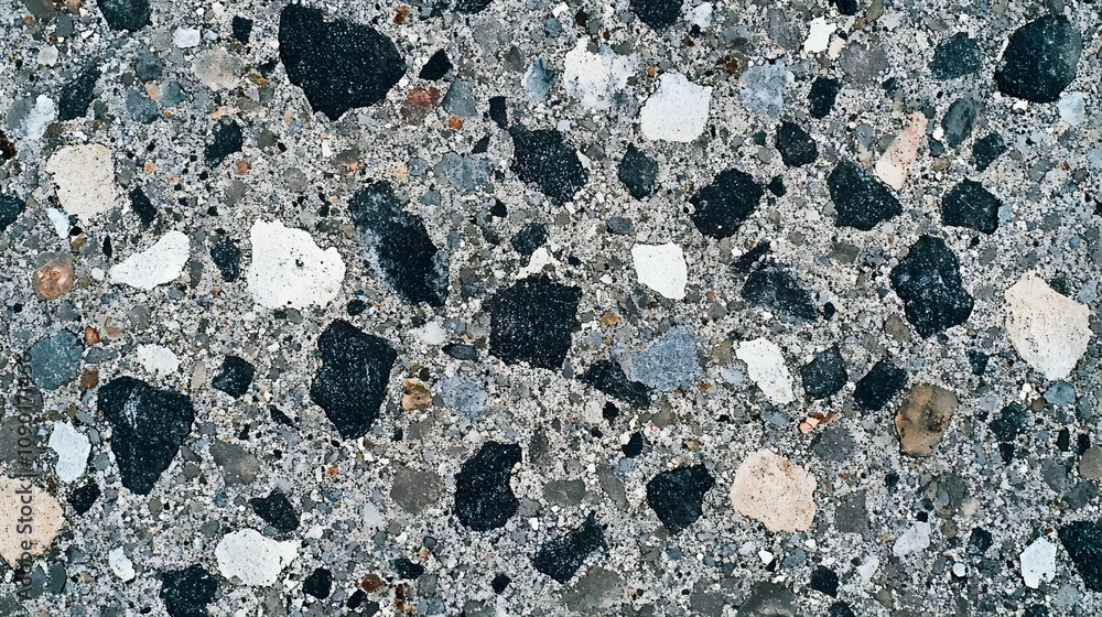 Aufkleber close-up texture of a gray concrete surface with embedded aggregate stones, featuring a mix of black