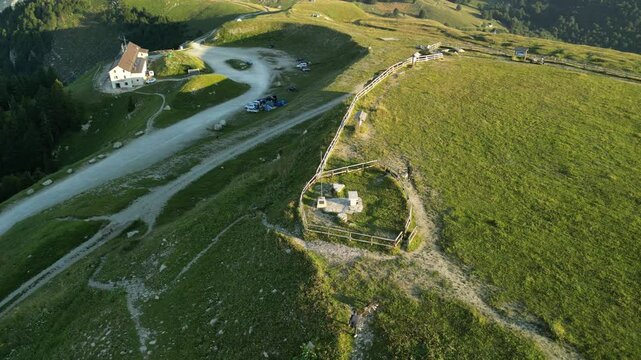 Aerial footage of the cross on Monte Pizzoc on a sunny day in Fregona, Province of Treviso, Italy