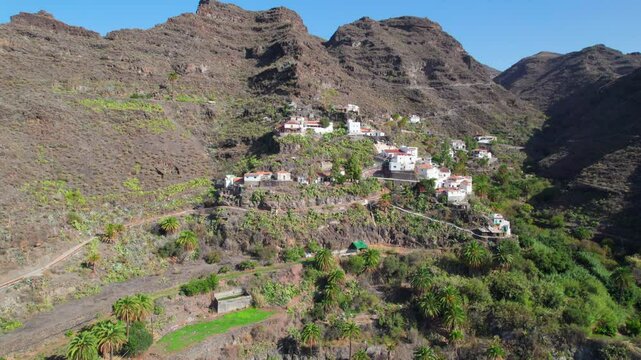 A Sunny Day on the Island of Gran Canaria: Carrizal de Tejeda Village and Its Volcanic Mountains from Cinematic Aerial Perspectives
