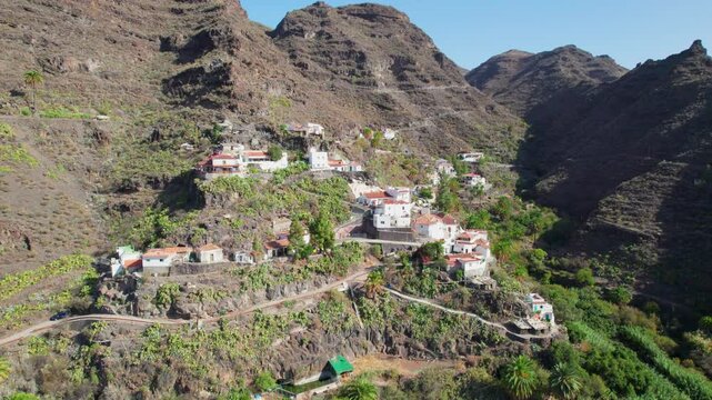 Cinematic Aerial Views of Carrizal de Tejeda Village on the Island of Gran Canaria and Its Volcanic Landscape on a Sunny Day