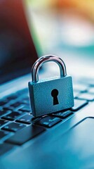A padlock rests on a laptop keyboard, symbolizing digital security and data protection in a modern technological environment.