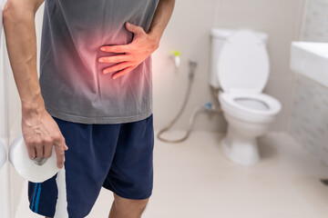 Constipation and diarrhea in bathroom. Hurt man touch belly  stomach ache painful. colon...