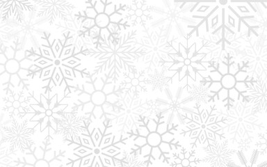 Christmas background of many layers of snowflakes of different shapes, sizes and transparency.