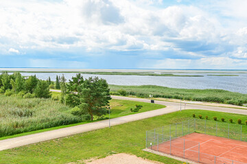 Fototapeta premium Panoramic view over Lake Luban, Lubanas ezers, from the viewpoint Udens Turisma Attistibas Centrs Baka - Summer lake landscape of the largest lake in Latvia, Vidzeme/Latgale