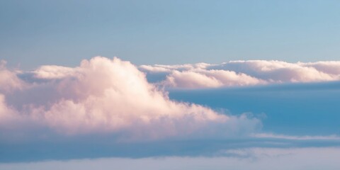Soft pink blue clouds fill the sky nature cloudscape background.