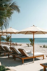 Beach loungers under umbrellas on white sand.