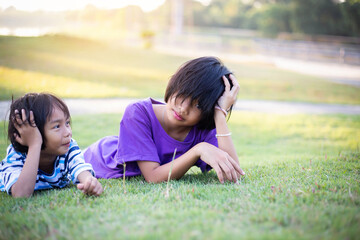 Two Girls on a Playing Field Hugging