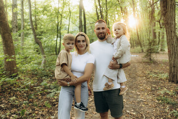 Fototapeta premium It's time for family quality time. Parents spending time with their children outside..