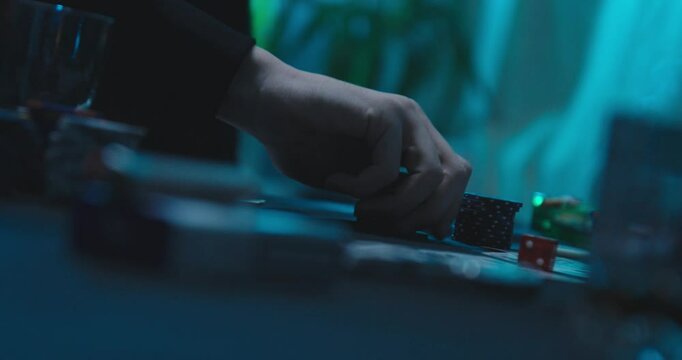 Man plays with his poker chips