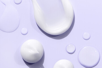 composition of smears of cream texture on pastel background