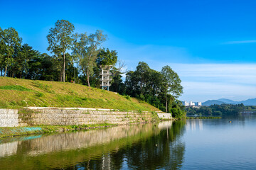 Embrace tranquility with this captivating image of a serene lake reflecting the vibrant blue sky...