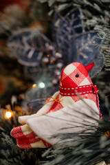 Decorated Christmas green tree decorations have bird hanging green leaves on blurred of background