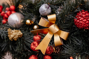 Close-up of festive Christmas decorations and string lights in a window