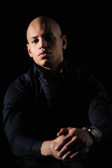 African american man in formal wear looking at camera isolated on black