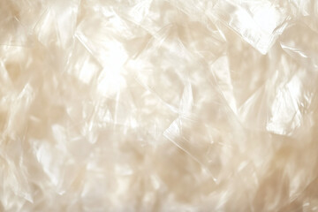 Obraz premium Close-up of the texture of wavy fabric with a soft shiny texture in beige tones.