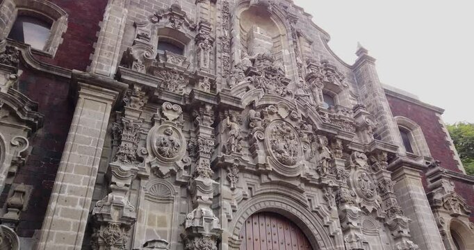 Downward shot capturing the details of the Baroque facade of the Miguel Lerdo de Tejada Library in the historic center of Mexico City