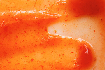 The delicious texture of chili sauce as a background, top view. Chili sauce