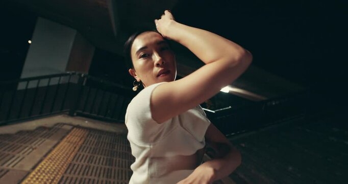Asian woman, night or dancer with motion for performance, kpop or choreography style in Japan. Japanese, female person or ballerina with fashion for ballet, fast dancing or time lapse in city or town