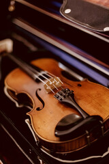 Fototapeta premium Violin, musical instrument, learning to play instruments, violin music, sheet music, musician, playing the violin, music school, developing skills, playing lessons, orchestra, philharmonic hall, churc