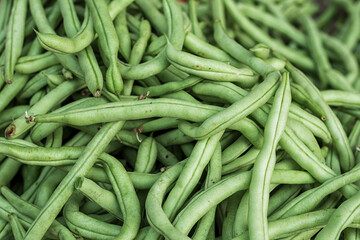 Fresh long beans or buncis or beans or kacang panjang are available in traditional markets, Heap of...