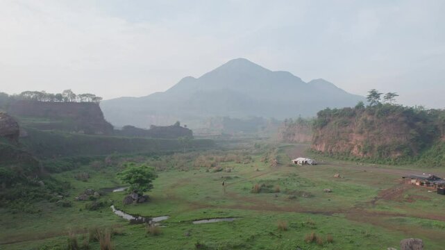 Aerial view of Ranu Manduro in East Java, Indonesia, captured by a professional on January 9, 2024. The video showcases the morning landscape of the savanna with a mountain in the background