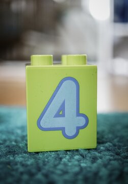 Lego Duplo toy block with number 4.