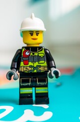 Naklejka premium Lego female fire fighter figurine.